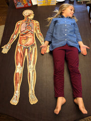 full size of the Full-Body Floor Puzzle compared to a child